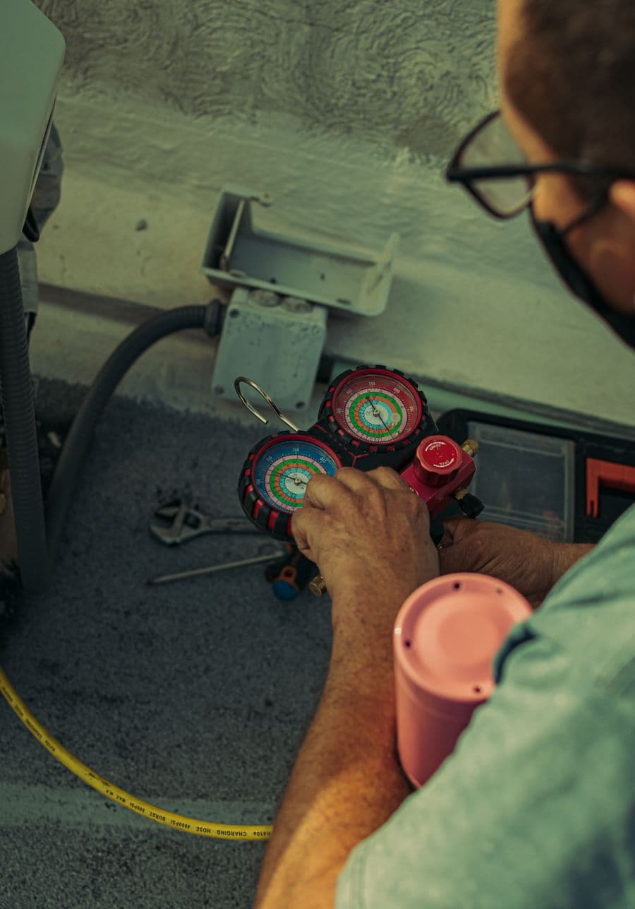 Refrigerant gauges on an AC service call
